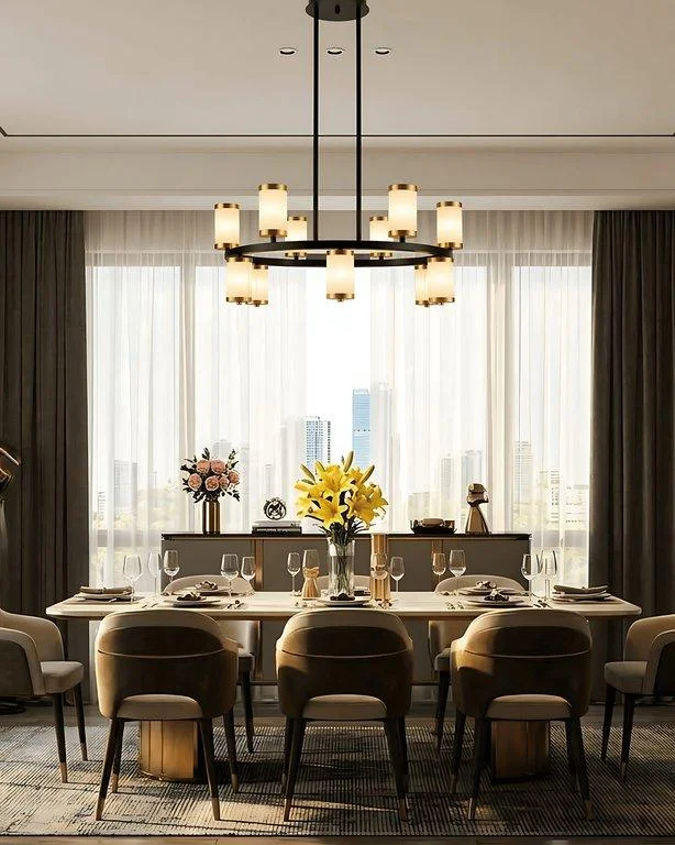 The Ryder black and gold chandelier over a dining table