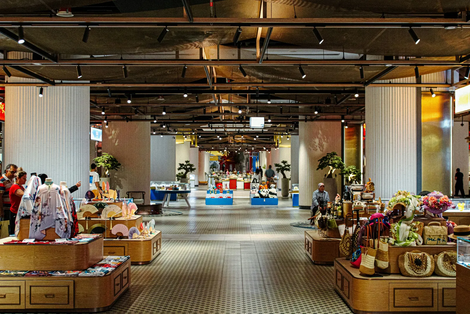 Retail floor with black track spotlights aimed at displays