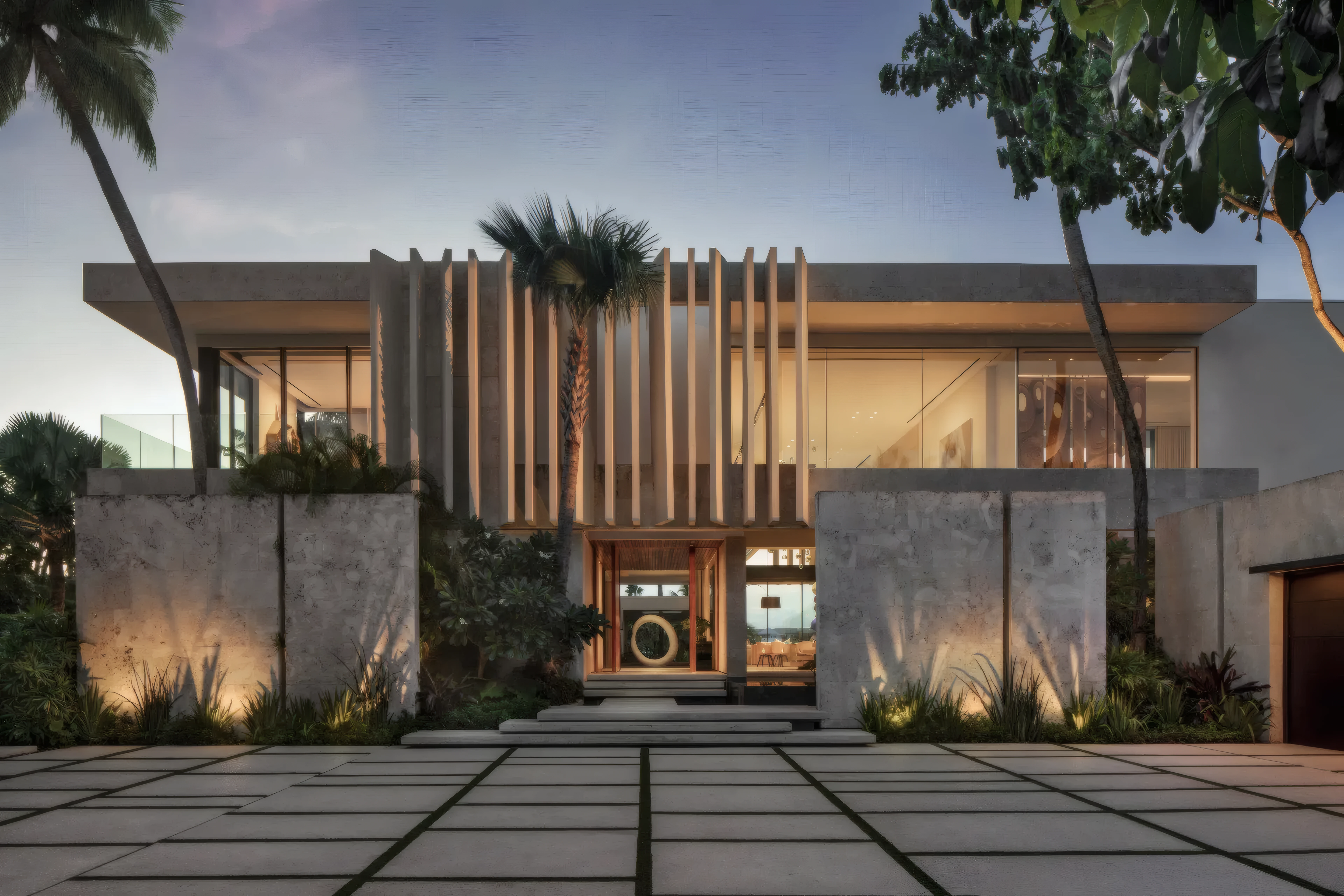 Facade with vertical wood fins washed in warm indirect wall light at dusk