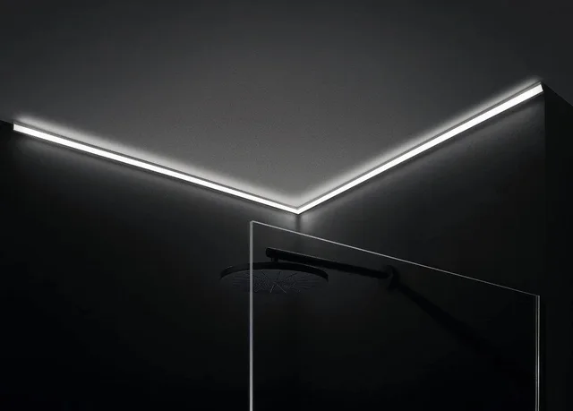 Corner LED profile lighting a wall and ceiling junction