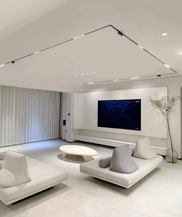 Living room with magnetic track spots outlining the ceiling